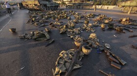 Clothes and weapons belonging to soldiers involved in the coup attempt that have now surrendered lie on the ground abandoned on Bosphorus Bridge on July 16, 2016, Istanbul, Turkey. (Gokhan Tan/Getty Images)