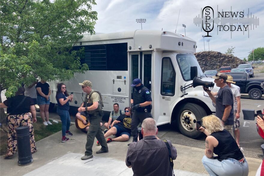 Some protesters outside the U.S. Immigration and Customs Office on Cataldo Avenue in Spokane interacted with masked and unmasked law enforcement officers on June 11.