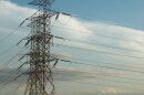 Transmission lines carry high-voltage electricity across large geographic areas from power plants to local substations that can then distribute it to homes and businesses.