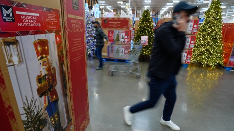 People shop among holiday displays at a Sam's Club, Wednesday, Sept. 24, 2025, in Bentonville, Ark.