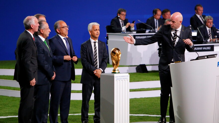 FIFA President Gianni Infantino, right, welcomes representatives of the united bid — from the U.S., Canada, and Mexico — as soccer's governing body selects its host for the 2026 FIFA World Cup during the 68th FIFA Congress in Moscow, Russia.