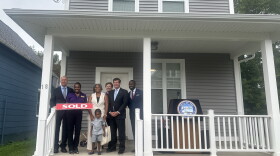 Walton family joined by City Officials as they celebrate the first home sold under the Building Buffalo Roots program