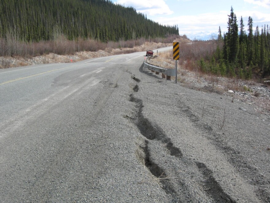 Permafrost thaw often creates cracks along the shoulders of the Alaska Highway, like these on a stretch of the road in the Yukon.