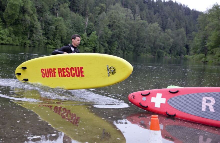 Lifeguard Andrew Fox practices a river rescue at Glenn Otto Park in Troutdale.