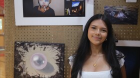Star Hernandez stands in front of her award-winning photograph, “Ojitos Mentirosos,” at the Glenwood Springs High School Art Show on May 20, 2026.