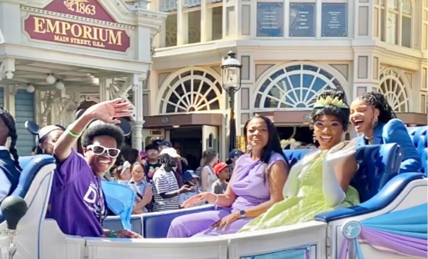 Bradley Ross Jackson, left, rose in the first all African American occupied Grand Marshal car at Disneyland with Halle Bailey, Disney's first Black Mermaid.