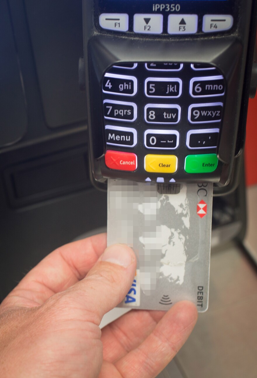 New embedded computer chips mean that the day is coming when you'll never swipe your credit card again. Instead, you'll insert them into readers like this.