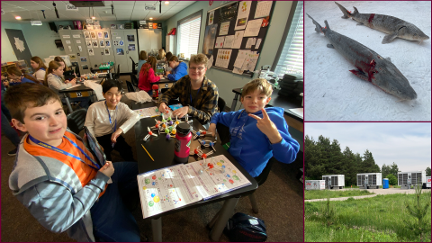 From left: Students at STARBASE Alpena pose for a photo in the middle of an assignment,