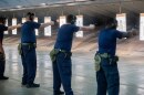 FILE - Immigration and Customs Enforcement (ICE) trainees practice shooting handguns at the indoor firing range at the Federal Law Enforcement Training Centers (FLETC) in Brunswick, Ga., Aug. 21, 2025. (AP Photo/Fran Ruchalski, File)