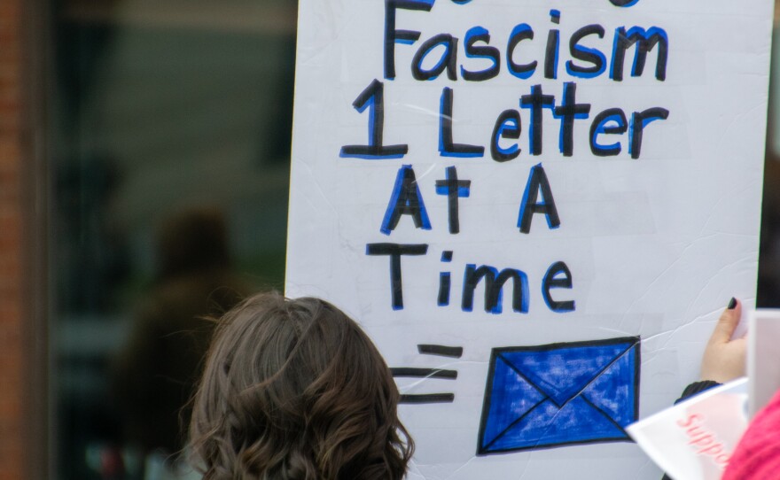 Protesters lined both sides of South Clinton Street in front of the Allen County Courthouse on Sunday, holding signs and braving the cold temperatures to demonstrate against privatizing the United States Postal Service.