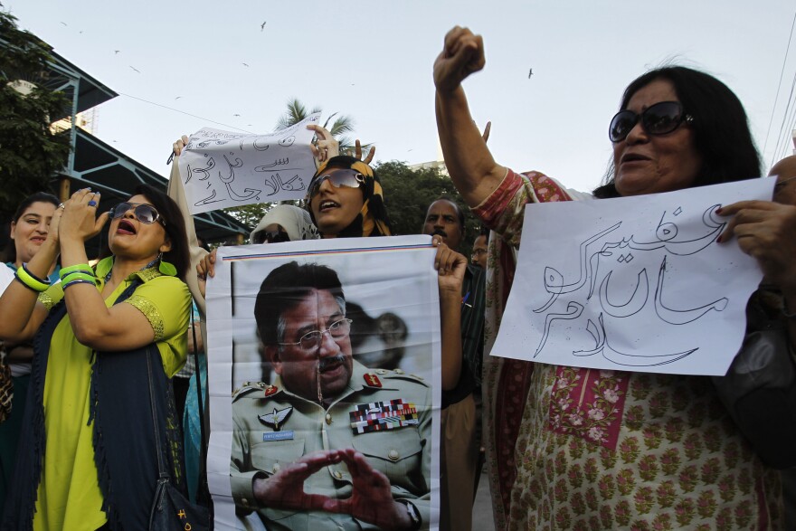 Musharraf supporters chant slogans on his behalf in Karachi on April 2, 2014.