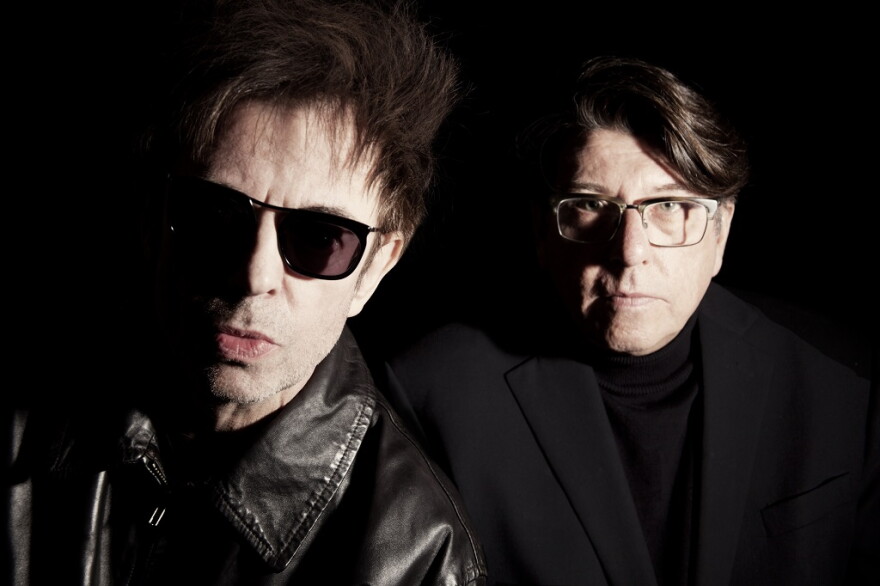 two men posing for a photograph 