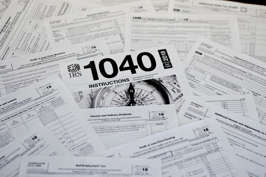 This photo made on Wednesday, Feb. 13, 2019, in Zelienople, Pa., shows mulitiple forms printed from the Internal Revenue Service web page that are used for 2018 U.S. federal tax returns. (AP Photo/Keith Srakocic)