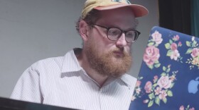 Dan Deacon works at his computer while scoring <em>Rat Film</em>