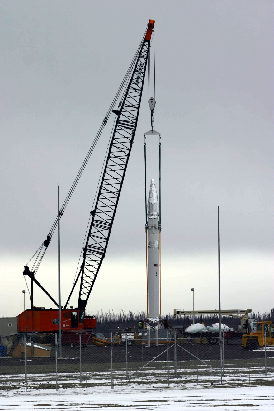 One of the first Ground-Based Interceptors is lowered into a silo at the Fort Greely missile base in 2004.