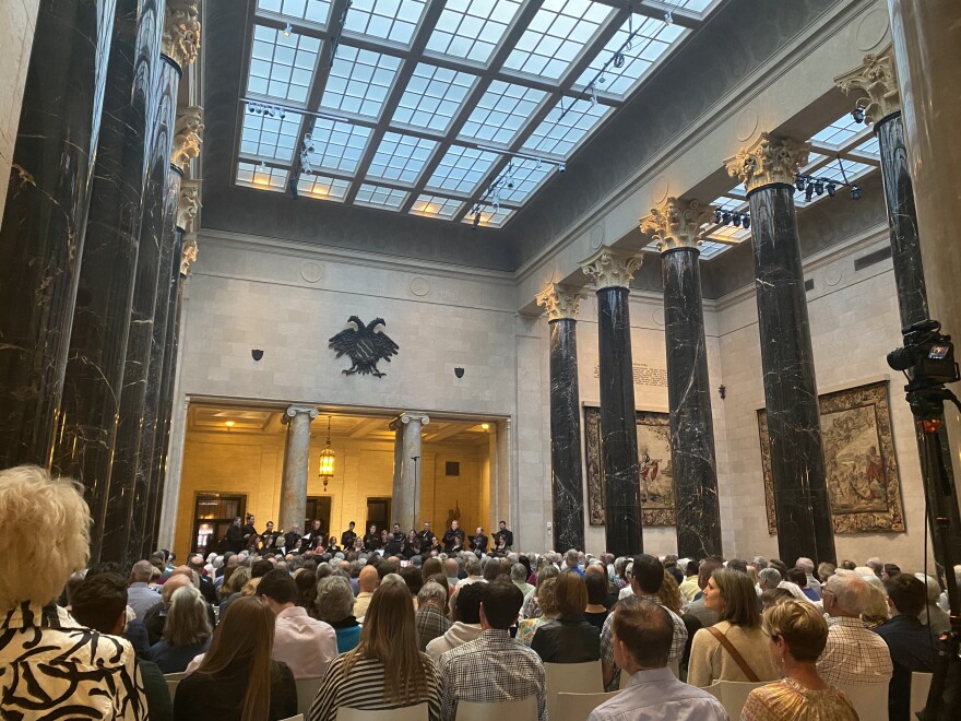 The Kansas City Chorale performs for the crowd inside Kirkwood Hall at the Nelson-Atkins Museum of Art