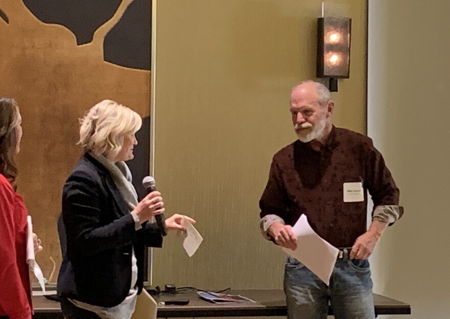 Mayor Emily Niehaus and Developer Mike Bynum speak at a development conference in Moab. 