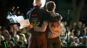 John Aielli and Elizabeth McQueen sings carols with the crowd at the 2018 KUT and KUTX Holiday Sing-Along