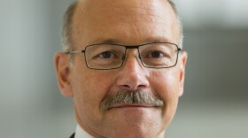 a portrait of a man in glasses