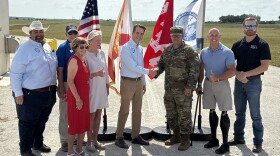 U.S. Army Corps of Engineers Jacksonville District Commander Col. Brandon Bowman and South Florida Water Management District Executive Director Drew Bartlett (center) shake hands to celebrate the milestone completions at the Indian River Lagoon South project. 