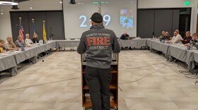 Isaac Rackliffe addresses a gathering of officials at a meeting to discuss the future of the North Summit Fire District. The entire roster of firefighters remains suspended.