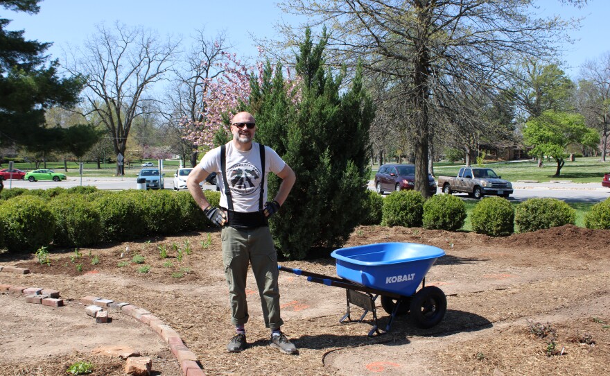 KSMU employee Seamus McKenzie showed up to help in April 2025 at the Phelps Grove Park gardens in Springfield, Mo.