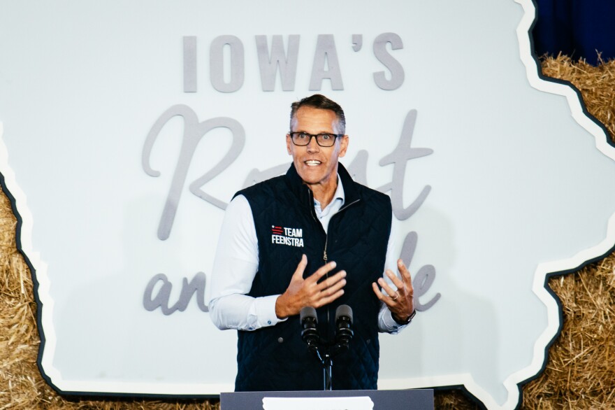 a man speaks at a podium