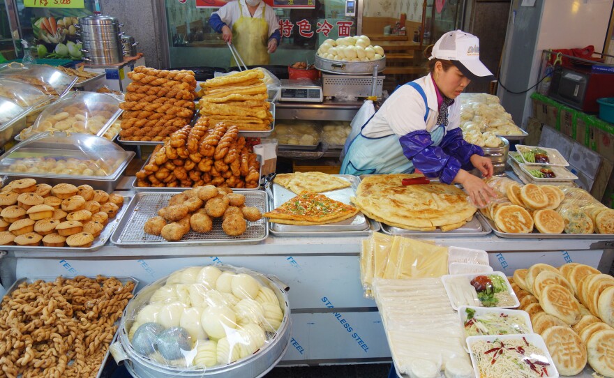 A food stall in South Korea's Wongok Village sells Chinese flatbreads and other snacks popular in China. Two-thirds of Wongok's residents are not ethnically Korean, and many of them are from China.