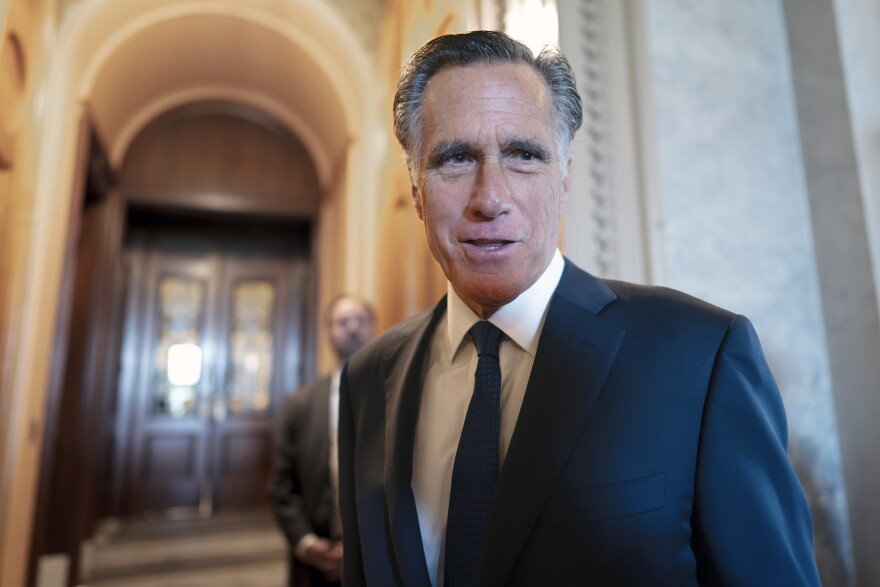 FILE - Sen. Mitt Romney, R-Utah, and other senators arrive at the chamber for votes, at the Capitol in Washington, Wednesday, Sept. 6, 2023. Romney will not run for reelection in 2024. The former presidential candidate and Massachusetts governor announced his intentions in a video statement Wednesday.