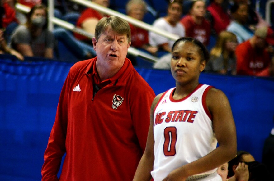  N.C. State head coach Wes Moore talks with Diamond Johnson during the 2022 ACC Tournament in Greensboro, N.C.