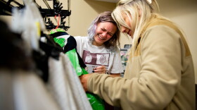 Samantha Buchanan, a senior chemistry major from Wildwood, Mo., reacts while adjusting a blazer alongside teammate Alex Gubera, a senior business and management systems major from Wentzville, Mo., on Tuesday, March 1, 2022, before the Missouri S&T’s first annual “Trashion Show” at the campus’ Havener Center in Rolla, Mo.