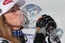 United States' Mikaela Shiffrin kisses the globe trophy for the alpine ski, women's slalom discipline, at the Lillehammer World Cup Finals, in Hafjell, Norway, Tuesday, March 24, 2026.