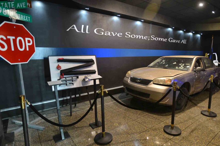 A somber and graphic display honoring the Kansas City police killed in the line of duty is part of the exhibit inside the Kansas City, Kansas, police museum.