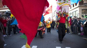 Members of the Master David F. Leong Dragon & Lion Group make their way to the main stage before performing the Lion Dance during the Lunar New Year celebration on Sunday, Feb. 11, 2018, in the Chinatown-International District in Seattle.