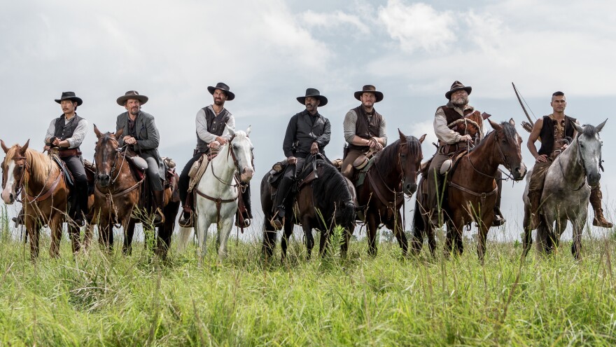 A group of seven bounty hunters, gamblers and hired guns (played by Byung-hun Lee, Ethan Hawke, Manuel Garcia-Rulfo, Denzel Washington, Chris Pratt, Vincent D'Onofrio and Martin Sensmeier) band together to protect a village in Antoine Fuqua's remake of <em>The Magnificent Seven. </em>