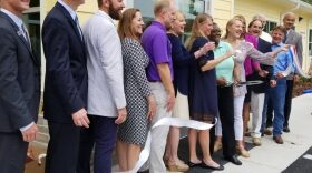 SWAG co-founder Joan Canton cutting the ribbon to the CHILD Center on June 6, 2018. (WUFT/Matthew Arrojas)