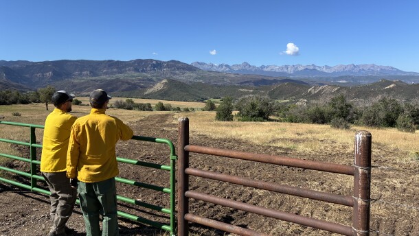Brody Wilson and Kevin Sweeney survey a fire line from the side of Owl Creek Pass. The dirt was in a 3 foot tall pile on one side, but has been replaced as a part of the work to rehabilitate public and private lands damaged during the fire.