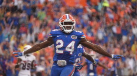 Florida defensive back Brian Poole (24) makes the sign for an incomplete pass after denying FAU wide receiver Jenson Stoshak (88) the ball on the final play in overtime, securing the Gator's victory over the Owls 20-14. (Greenberry Taylor/ WUFT News)