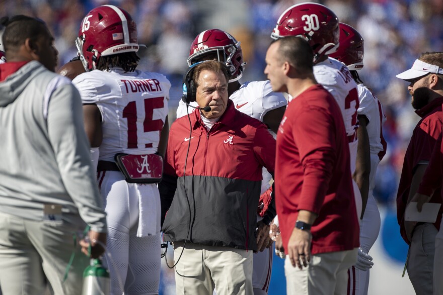 Alabama head coach Nick Saban stands in a huddle during the first half of an NCAA college football game in Lexington, Ky., Saturday, Nov. 11, 2023. (AP Photo/Michelle Haas Hutchins)