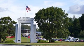 A line of vehicles wait to enter Canada at the Peace Arch border crossing Monday, Aug. 9, 2021, in Blaine, Wash. Immigration officers took custody of a Portland-area mother and her children while the family was visiting Peace Arch State Park near the U.S.-Canada border.