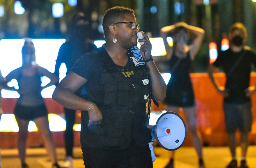 Kansas City lawyer Stacy Shaw reminds the crowd late Saturday night that “this is a movement born out of love.” She added, “We will continue resisting by all legal means necessary.”&#13;
