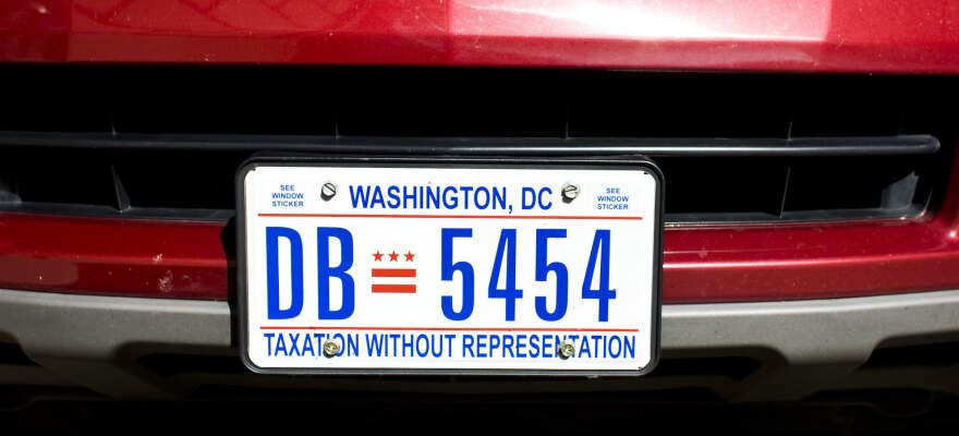 D.C. residents show their support for statehood with a license plate that reads, "Taxation Without Representation."