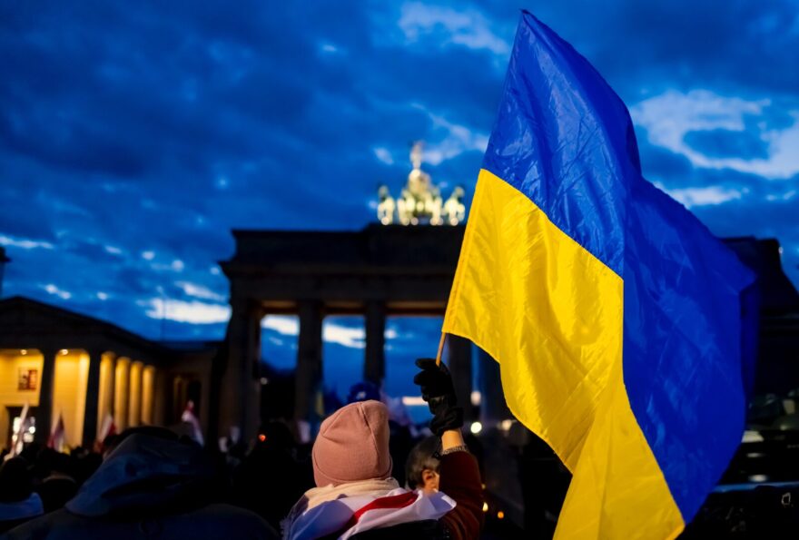 People protest in front of the Brandenburg gate against the Russian invasion of Ukraine in Berlin, Germany.