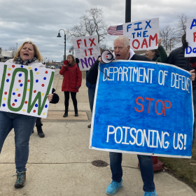 Oscoda residents and Need Our Water (NOW) members rally in favor of additional PFAS clean-up measures on the former Wurtsmith Air Force Base in Oscoda on Feb. 15, 2023.