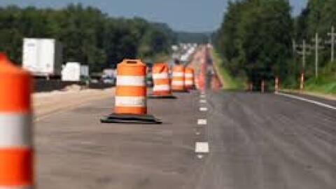 orange barrels on a highway