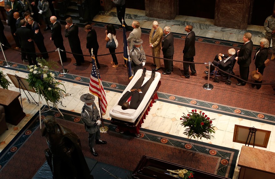 Mourners view the body of state Sen. Clementa Pinckney as he lay in state at the South Carolina State House Wednesday. Pinckney was one of nine people killed during a Bible study inside Emanuel AME church in Charleston.