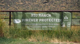 A sign celebrates Summit County's acquisition of the 8,800-acre 910 Ranch, seen here on Aug. 5, 2026.