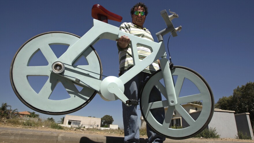 Israeli inventor and his cardboard bicycle.