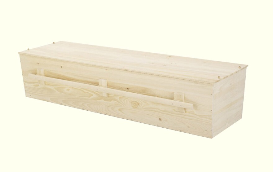 This simple unvarnished pine box is a customary choice for Jewish burials.