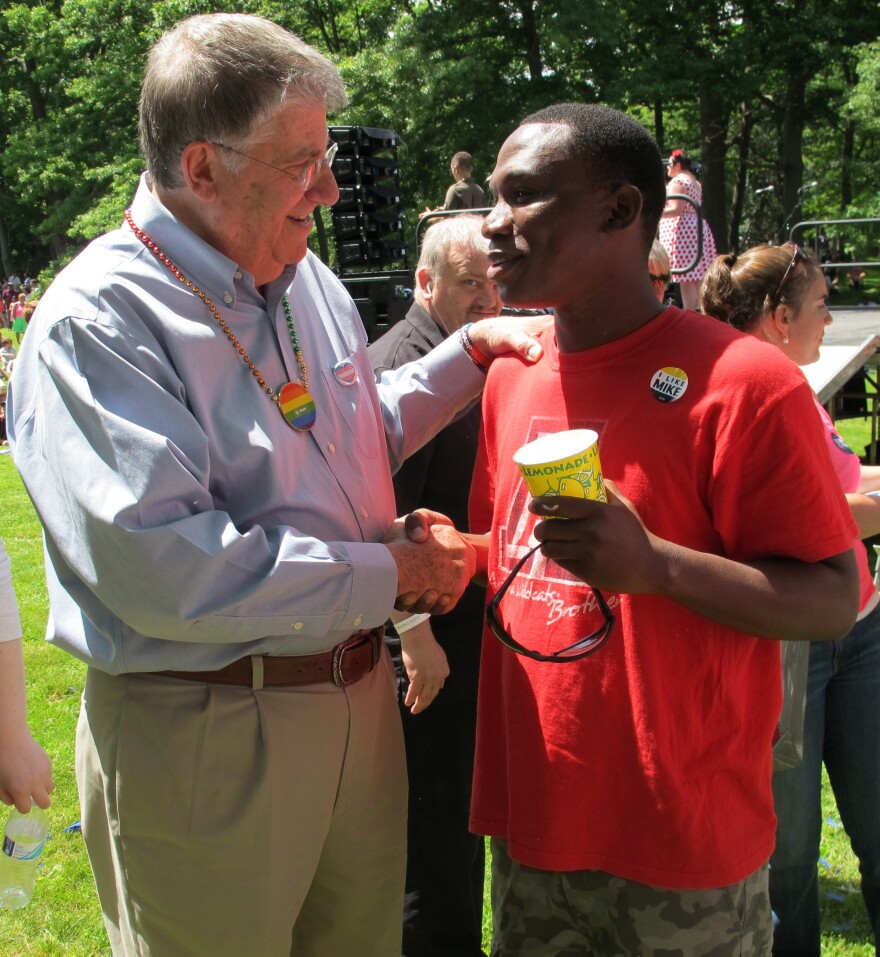 Eliot Cutler, who is running as an independent candidate for Maine governor, speaks to a man at the Pride Parade and Festival in Portland, Maine, on June 21.